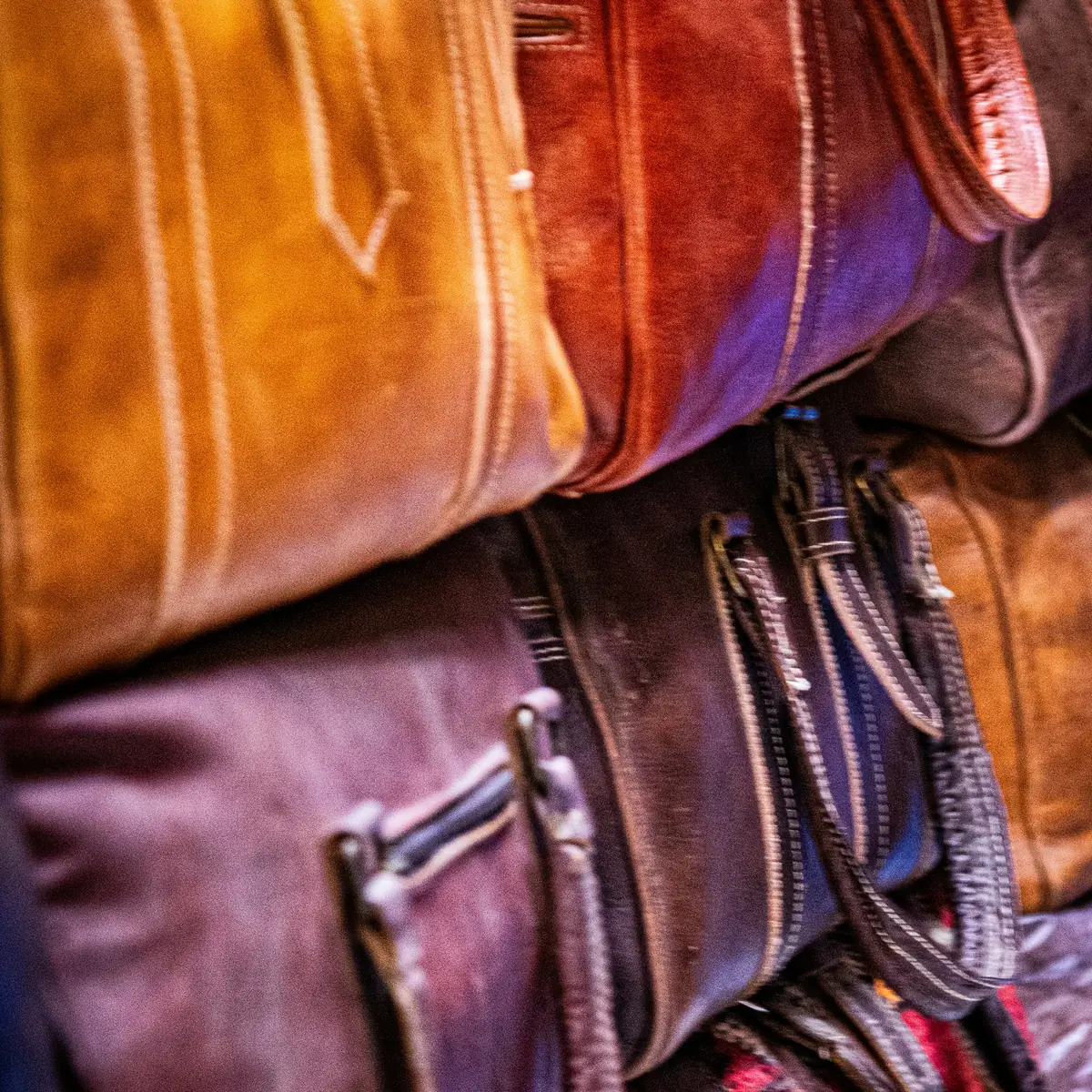 Stacks of leather bags in rich colours